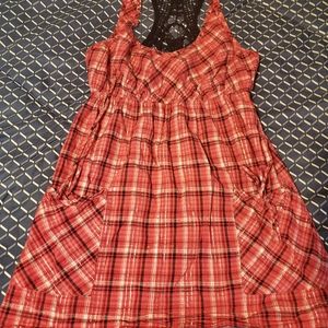 Pink shirt with black design in the back.